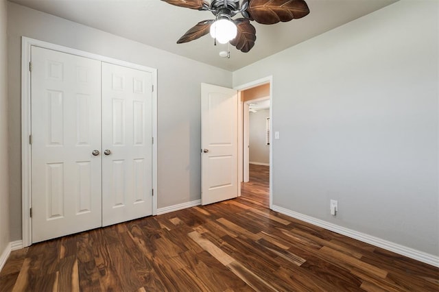 300 Yukon Ave, Yukon, OK 73099 - unfurnished bedroom with dark wood finished floors, a closet, and a ceiling fan