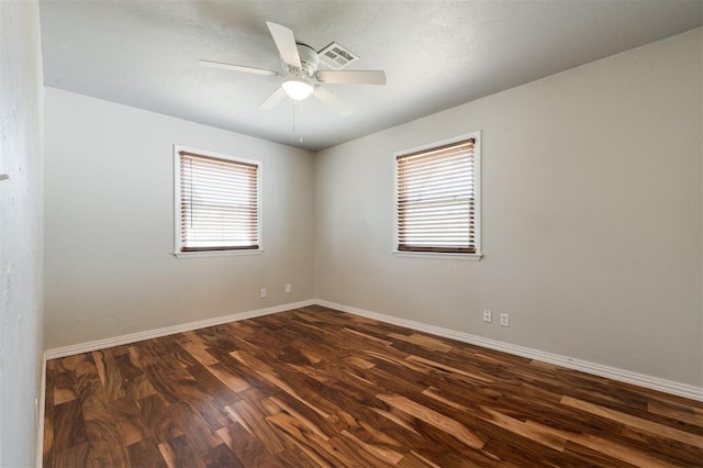 300 Yukon Ave, Yukon, OK 73099 - empty room featuring dark wood-style floors and a ceiling fan
