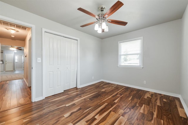 300 Yukon Ave, Yukon, OK 73099 - unfurnished bedroom featuring wood finished floors, a closet, and a ceiling fan
