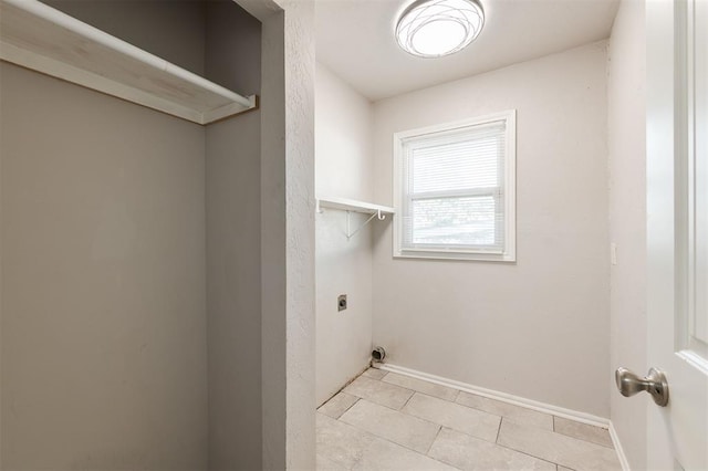 300 Yukon Ave, Yukon, OK 73099 - laundry room with hookup for an electric dryer and light tile patterned floors
