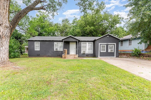 3701 Woodside Dr, Oklahoma City, OK 73110 - view of front facade featuring a front lawn, concrete driveway, cooling unit, and crawl space