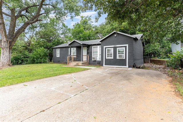 3701 Woodside Dr, Oklahoma City, OK 73110 - view of front facade featuring a front lawn, crawl space, concrete driveway, a shingled roof, and cooling unit