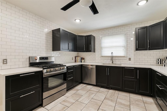 2800 Kerry Ln, Oklahoma City, OK 73120 - kitchen featuring stainless steel appliances, dark cabinetry, ceiling fan, backsplash, and recessed lighting
