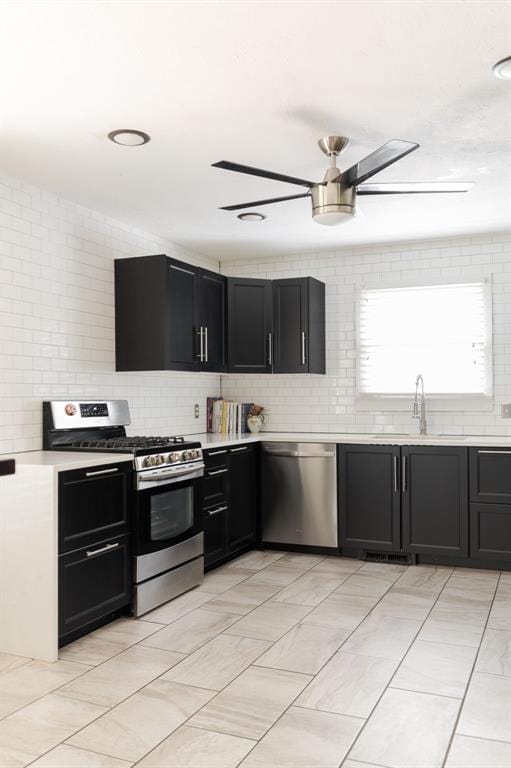 2800 Kerry Ln, Oklahoma City, OK 73120 - kitchen featuring appliances with stainless steel finishes, dark cabinetry, light countertops, and backsplash