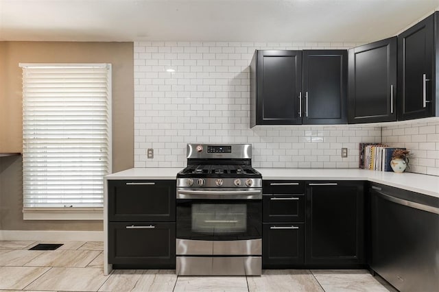 2800 Kerry Ln, Oklahoma City, OK 73120 - kitchen with appliances with stainless steel finishes, dark cabinetry, and light countertops
