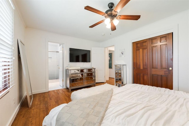 2800 Kerry Ln, Oklahoma City, OK 73120 - bedroom with a closet, wood finished floors, ornamental molding, ceiling fan, and ensuite bathroom