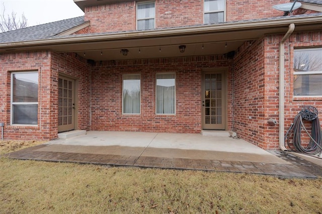 3101 White Cedar Dr, Moore, OK 73160 - rear view of house with brick siding and a patio area