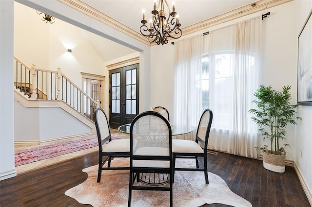 3101 White Cedar Dr, Moore, OK 73160 - dining room featuring a chandelier, hardwood / wood-style floors, stairs, french doors, and ornamental molding