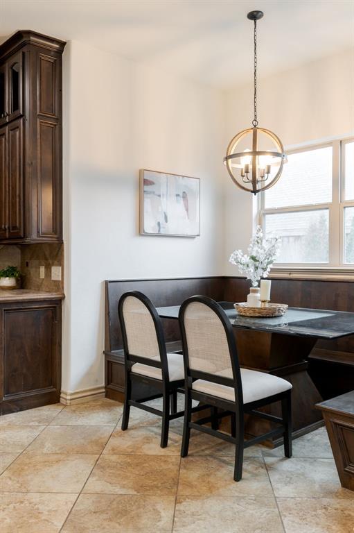 3101 White Cedar Dr, Moore, OK 73160 - dining room with a chandelier and light tile patterned floors