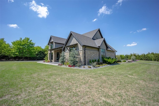 18569 310th St, Norman, OK 73072 - view of property exterior with board and batten siding, a lawn, and stone siding