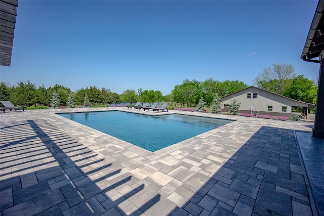 18569 310th St, Norman, OK 73072 - swimming pool featuring a patio area and view of wooded area
