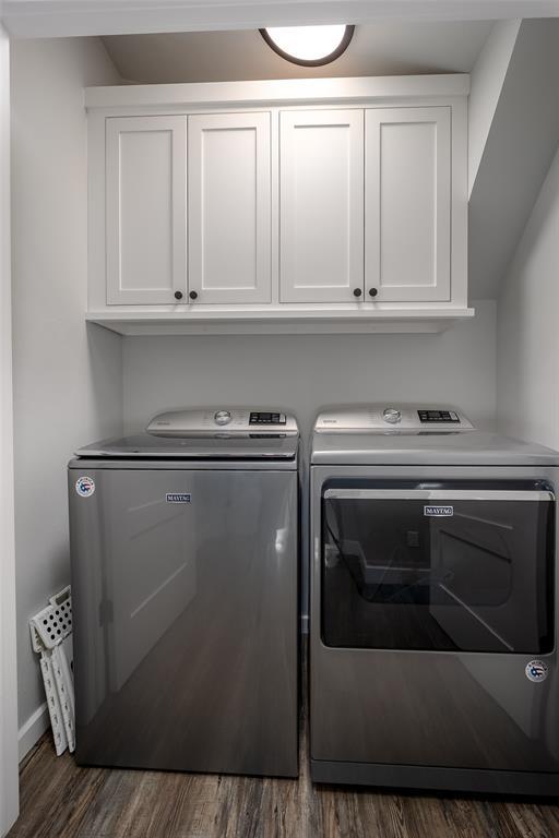 18569 310th St, Norman, OK 73072 - washroom with washing machine and clothes dryer, cabinet space, and wood finished floors