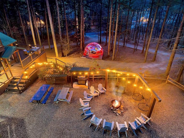 225 Stevens Rd, Broken Bow, OK 74728 - view of yard with an outdoor fire pit