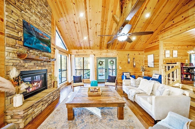225 Stevens Rd, Broken Bow, OK 74728 - living area with hardwood / wood-style flooring, wooden ceiling, plenty of natural light, a stone fireplace, and high vaulted ceiling