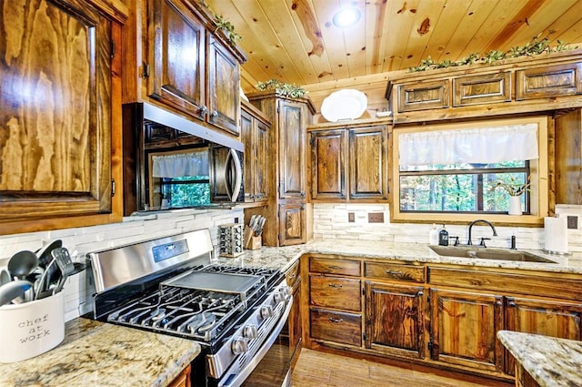 225 Stevens Rd, Broken Bow, OK 74728 - kitchen featuring appliances with stainless steel finishes, backsplash, light stone countertops, and wooden ceiling