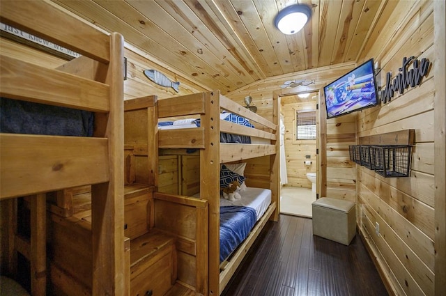 225 Stevens Rd, Broken Bow, OK 74728 - bedroom with wooden walls, wood ceiling, and dark wood-type flooring
