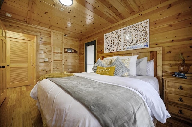 225 Stevens Rd, Broken Bow, OK 74728 - bedroom featuring wood ceiling, wood walls, and hardwood / wood-style floors
