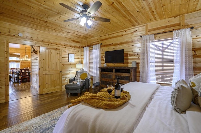 225 Stevens Rd, Broken Bow, OK 74728 - bedroom with wooden walls, hardwood / wood-style flooring, wood ceiling, and a chandelier