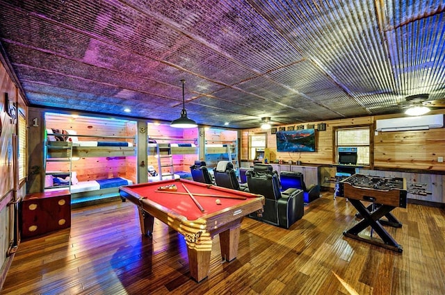 225 Stevens Rd, Broken Bow, OK 74728 - game room with a wall unit AC, wood walls, a ceiling fan, billiards table, and wood-type flooring