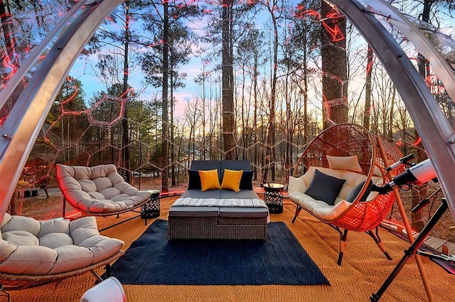 225 Stevens Rd, Broken Bow, OK 74728 - patio terrace at dusk with outdoor lounge area
