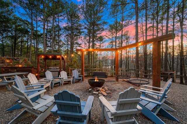 225 Stevens Rd, Broken Bow, OK 74728 - view of patio / terrace with a fire pit
