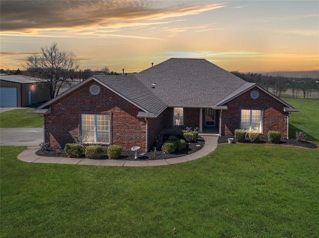 1848 County Road 1198, Tuttle, OK 73089 - view of front of home featuring brick siding, a yard, and a garage