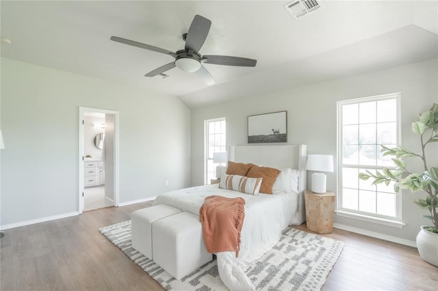 1848 County Road 1198, Tuttle, OK 73089 - bedroom featuring wood finished floors, a ceiling fan, and connected bathroom