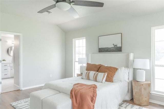 1848 County Road 1198, Tuttle, OK 73089 - bedroom with light wood finished floors, lofted ceiling, a ceiling fan, and connected bathroom