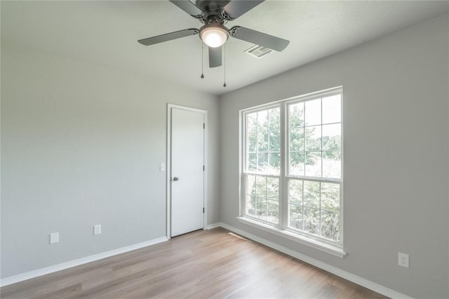 1848 County Road 1198, Tuttle, OK 73089 - unfurnished room featuring plenty of natural light, light wood-style flooring, and ceiling fan