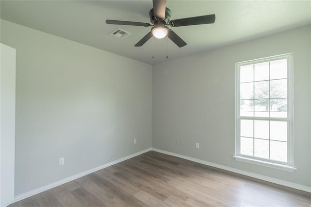 1848 County Road 1198, Tuttle, OK 73089 - unfurnished room featuring wood finished floors and a ceiling fan