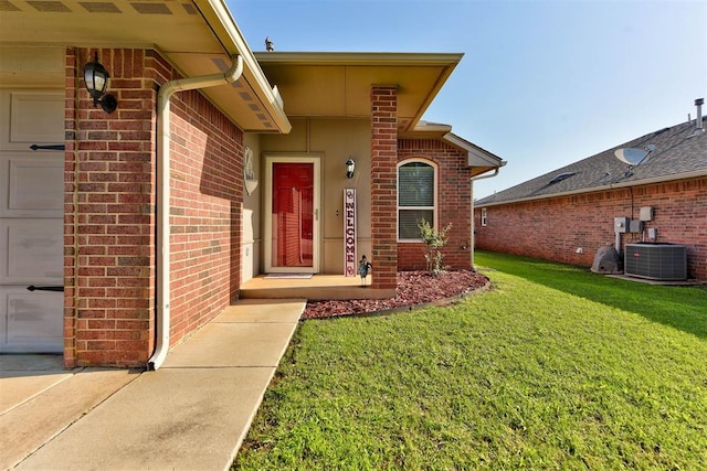 2233 NW 196th St, Edmond, OK 73012 - doorway to property featuring a yard, brick siding, and an attached garage