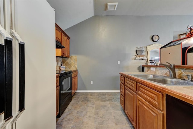 2233 NW 196th St, Edmond, OK 73012 - kitchen with black electric range oven, dishwasher, lofted ceiling, tasteful backsplash, and brown cabinets