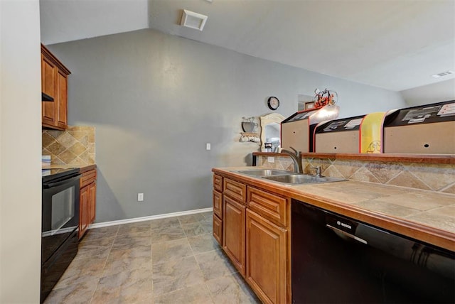 2233 NW 196th St, Edmond, OK 73012 - kitchen featuring black appliances, lofted ceiling, tile countertops, tasteful backsplash, and brown cabinets