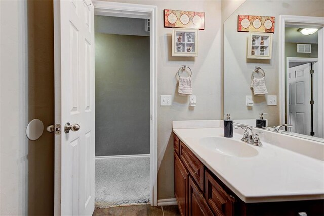 2233 NW 196th St, Edmond, OK 73012 - bathroom with vanity and baseboards