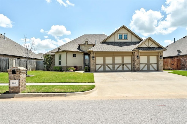 4600 Kentucky Ridge Dr, Mustang, OK 73064 - view of front facade with a garage, driveway, stucco siding, and a shingled roof
