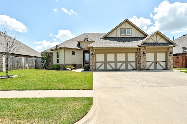 4600 Kentucky Ridge Dr, Mustang, OK 73064 - view of front facade with driveway, a garage, a shingled roof, and stucco siding