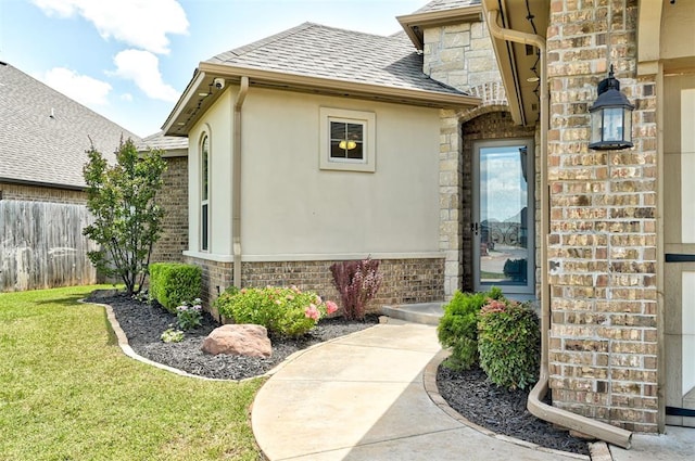 4600 Kentucky Ridge Dr, Mustang, OK 73064 - entrance to property with brick siding, stucco siding, a shingled roof, and stone siding