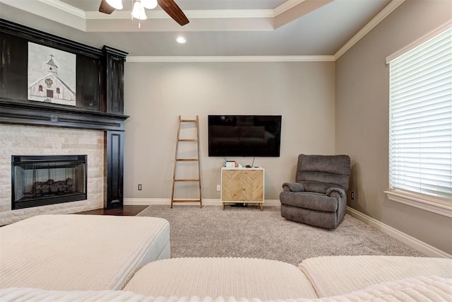4600 Kentucky Ridge Dr, Mustang, OK 73064 - living room featuring a ceiling fan, carpet floors, ornamental molding, recessed lighting, and a fireplace
