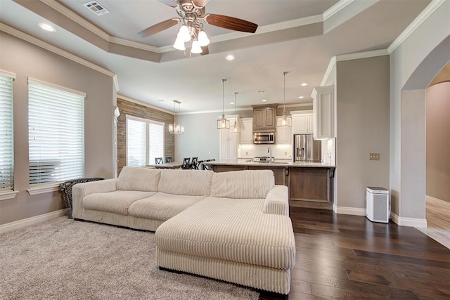 4600 Kentucky Ridge Dr, Mustang, OK 73064 - living room with ceiling fan, a raised ceiling, ornamental molding, recessed lighting, and dark wood finished floors