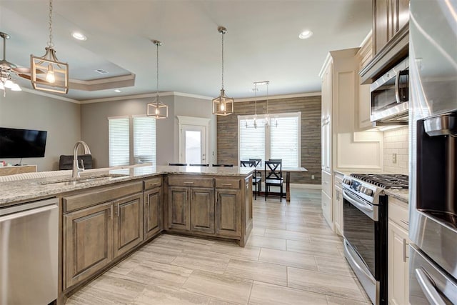 4600 Kentucky Ridge Dr, Mustang, OK 73064 - kitchen with appliances with stainless steel finishes, crown molding, backsplash, light stone countertops, and recessed lighting