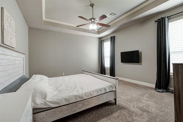 4600 Kentucky Ridge Dr, Mustang, OK 73064 - carpeted bedroom featuring a raised ceiling and a ceiling fan