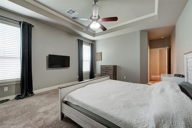 4600 Kentucky Ridge Dr, Mustang, OK 73064 - bedroom with a raised ceiling, carpet flooring, ceiling fan, ensuite bath, and crown molding