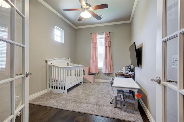 4600 Kentucky Ridge Dr, Mustang, OK 73064 - bedroom with crown molding, wood finished floors, a crib, and ceiling fan