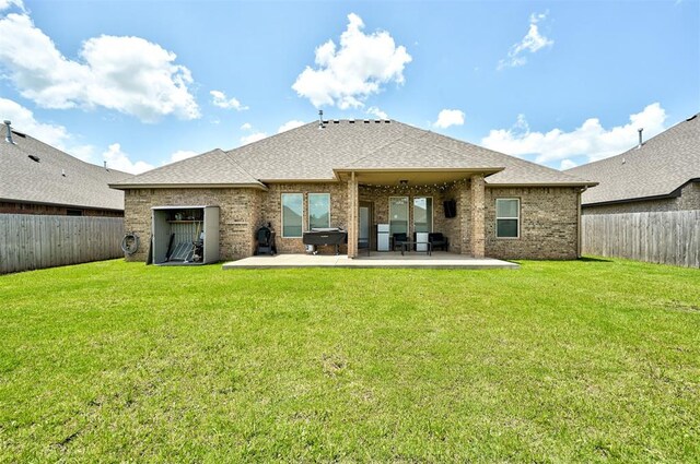 4600 Kentucky Ridge Dr, Mustang, OK 73064 - rear view of house with a patio area, a shingled roof, and a fenced backyard