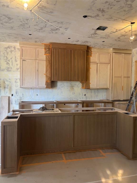 8209 Buffalo Rdg, Arcadia, OK 73007 - kitchen with light brown cabinets and ventilation hood