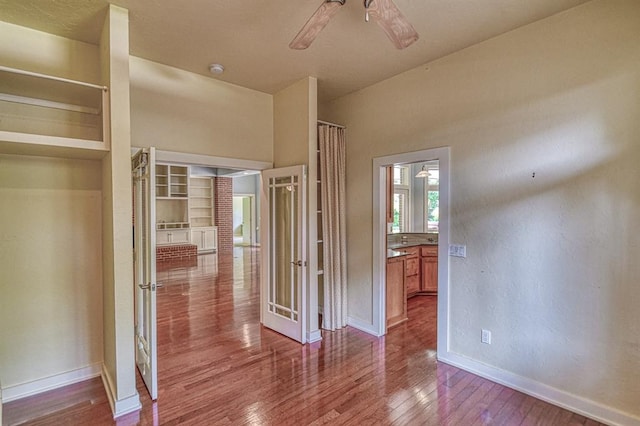 823 S Flood Ave, Norman, OK 73069 - unfurnished bedroom with hardwood / wood-style floors and ceiling fan