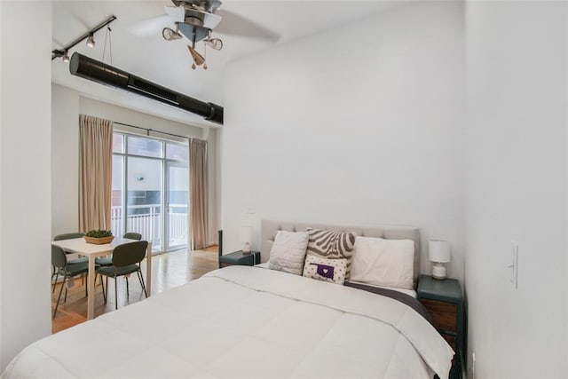 1 NE 2nd St Unit 402, Oklahoma City, OK 73104 - bedroom featuring access to exterior and wood finished floors