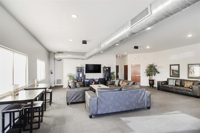 1 NE 2nd St Unit 402, Oklahoma City, OK 73104 - living area with carpet and recessed lighting