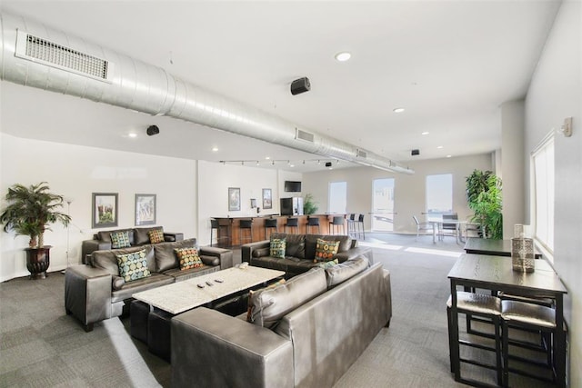 1 NE 2nd St Unit 402, Oklahoma City, OK 73104 - living area with carpet floors and recessed lighting