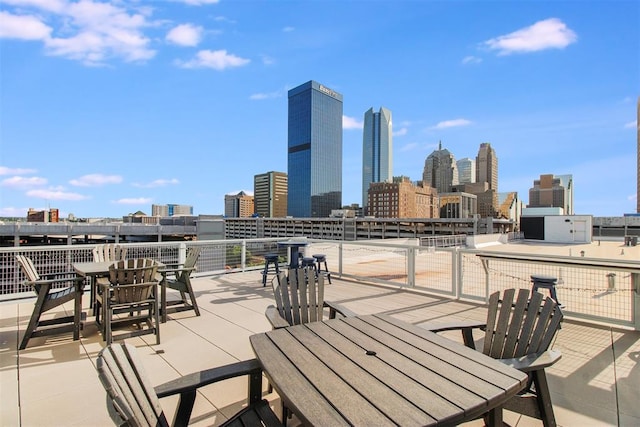 1 NE 2nd St Unit 402, Oklahoma City, OK 73104 - view of patio with outdoor dining area and a skyline view